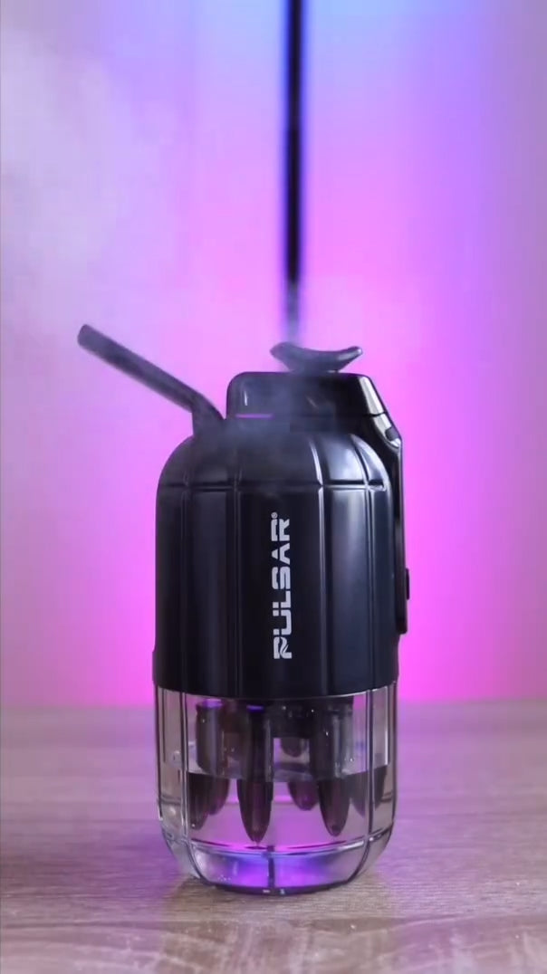 A dynamic, side-profile studio product shot of the Pulsar Dabtron 2.0 eRig in Jet Black styled in an active layout. The image showcases the sleek matte black finish of the grenade-shaped power chassis and the secure configuration of the transparent, durable perspex water base chamber on a clean background.