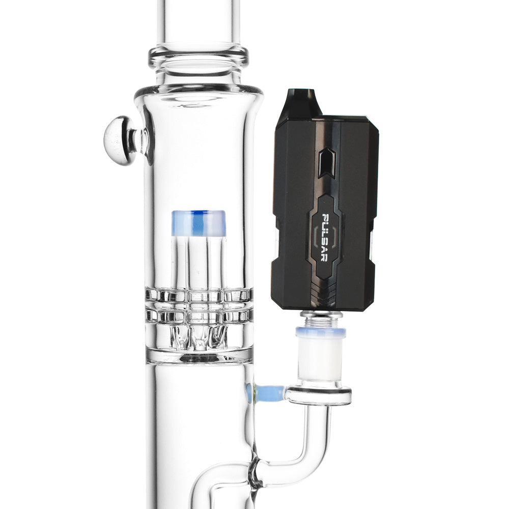 A detailed close-up of the H2O Black Pulsar DuploCart H2O connected to a glass water pipe, highlighting the secure fit of the 14mm/19mm adapter.