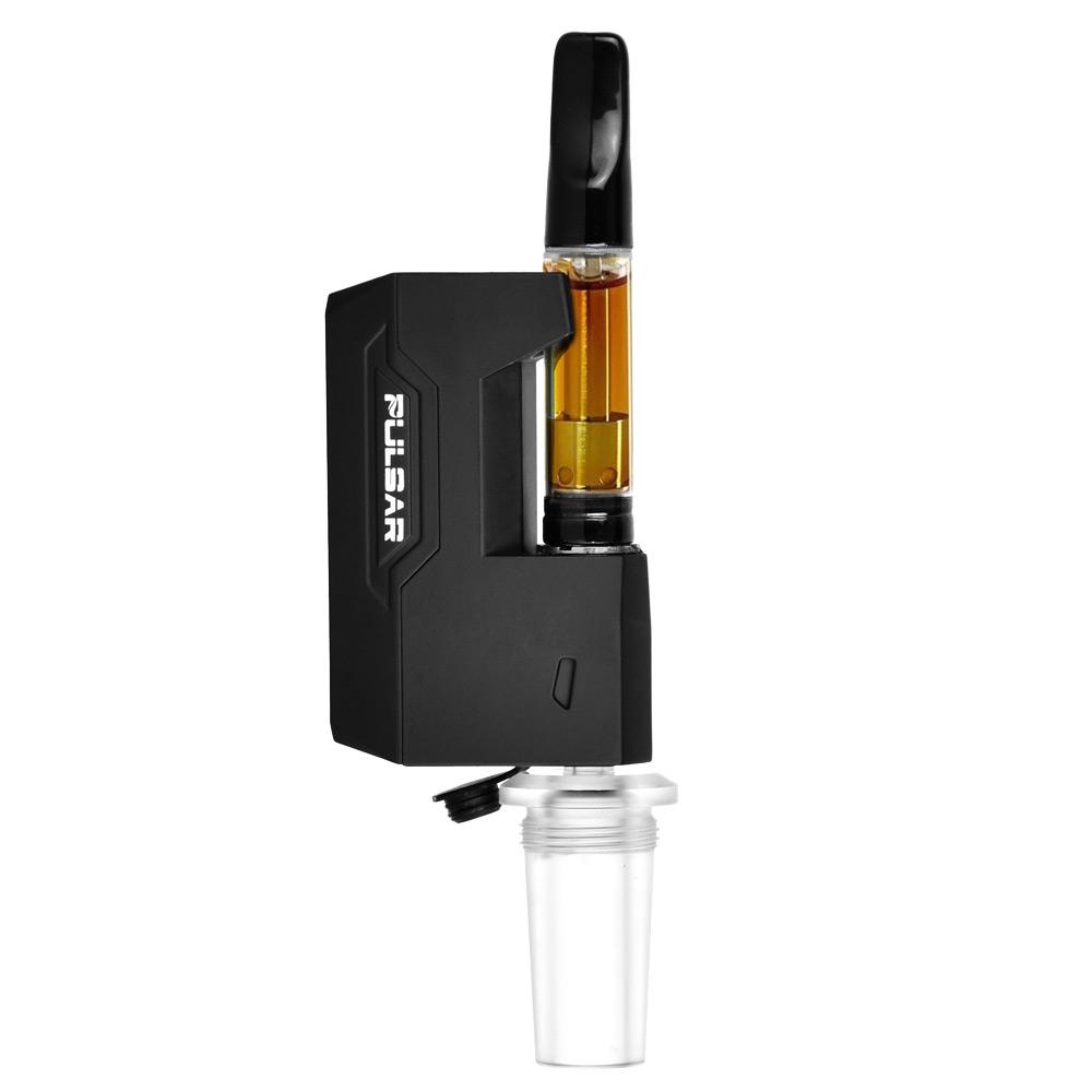 A crisp studio product shot of the Pulsar GiGi H2O 510 vape battery in Matte Black set up for water pipe configuration. A standard 510-threaded clear oil cartridge is loaded into the top terminal, while the bottom of the compact, rectangular device features the universal 14mm/19mm male glass-and-silicone water pipe adapter threaded tightly into place, demonstrating its rig-ready capabilities.