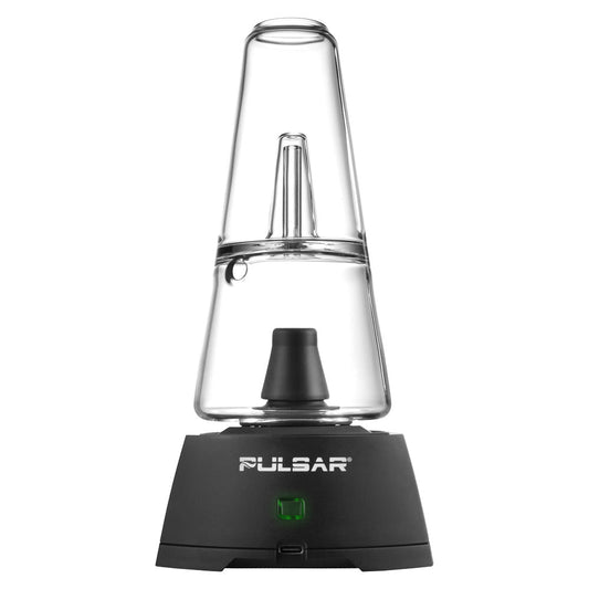A front-facing vertical studio shot of the Pulsar Sipper Bubbler Cup Edition. The device features a matte black base with a central circular touchpad control ring, topped with a clear borosilicate glass bubbler cup showing internal water filtration percs and a clear protective cover over the cartridge chamber.