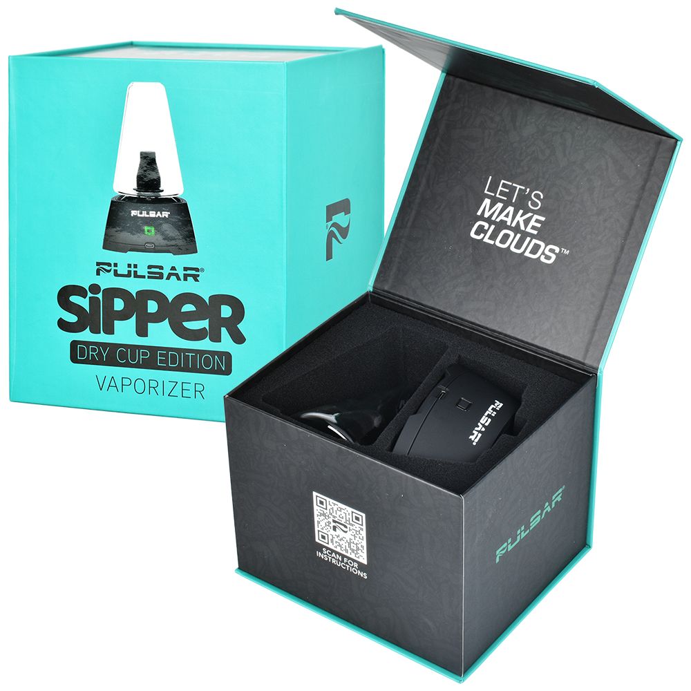 The Pulsar Sipper retail packaging shown alongside an open box displaying the fully unboxed contents. The layout reveals the matte black vaporizer base, the clear borosilicate glass dry cup, the triple quartz coil atomizer, a 510 cartridge adapter, a stainless steel dab tool, and the USB-C charging cable neatly arranged on a studio surface.