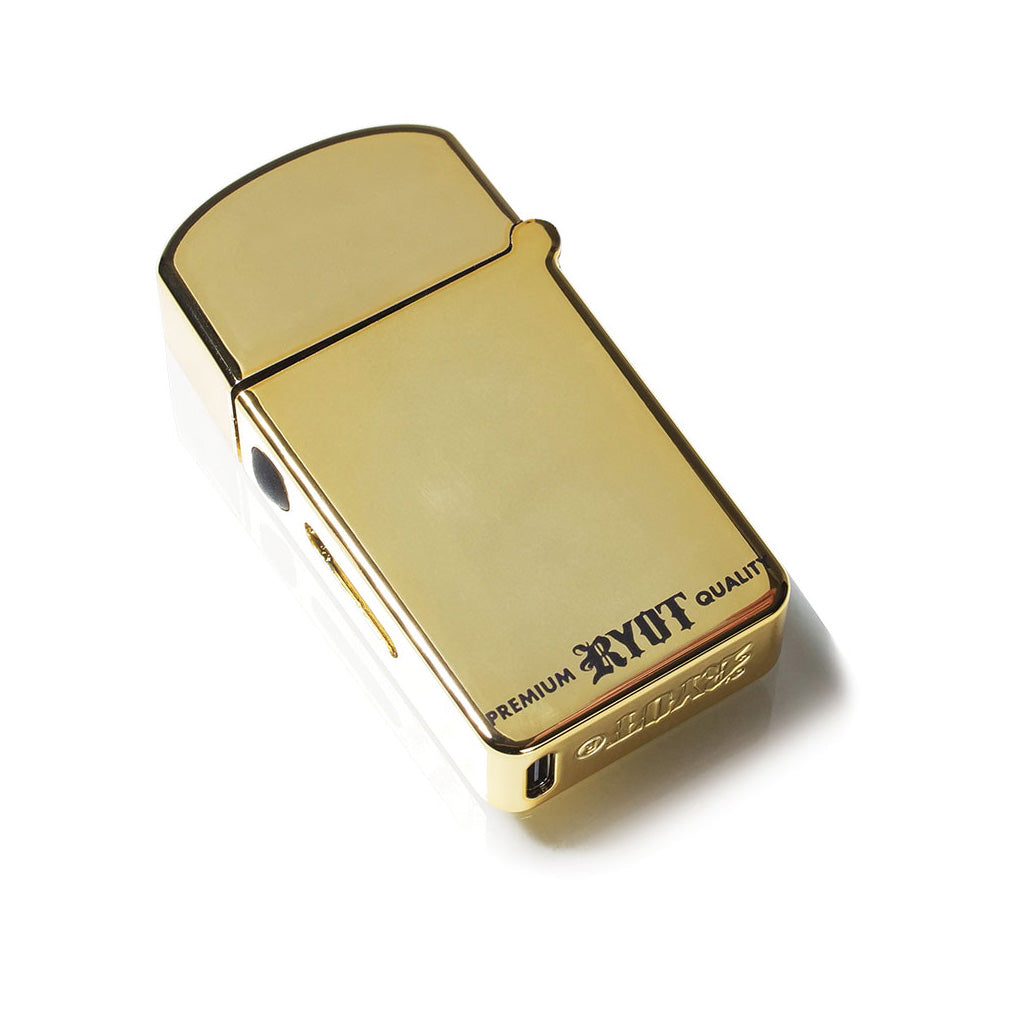 Polished Gold RYOT Verb 710 Flip showing the bottom USB-C charging port and premium metal construction.