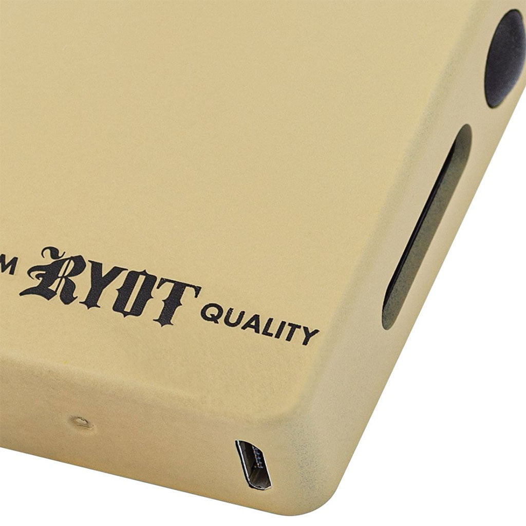 Close-up of the Sand-colored RYOT Verb battery highlighting the Micro USB charging port and "Premium RYOT Quality" branding.