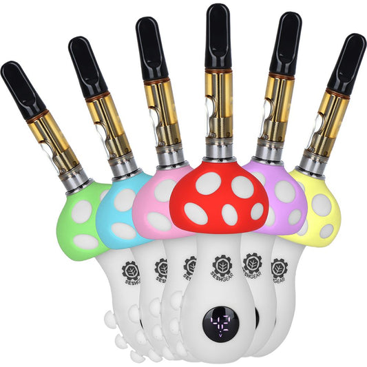 A vibrant group shot of the SeshGear Mushroom 510 Battery in all six color options: Red, Yellow, Green, Blue, Purple, and Pink. Each device is shown with a 510-thread cartridge installed, highlighting the spotted mushroom cap design and stable base.