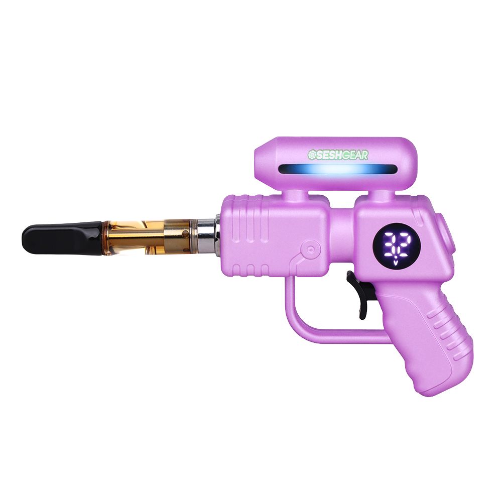 SeshGear Ray Gun in Purple, highlighting the vibrant color finish, the tactile trigger power button, and an oil cartridge securely attached to the "barrel."