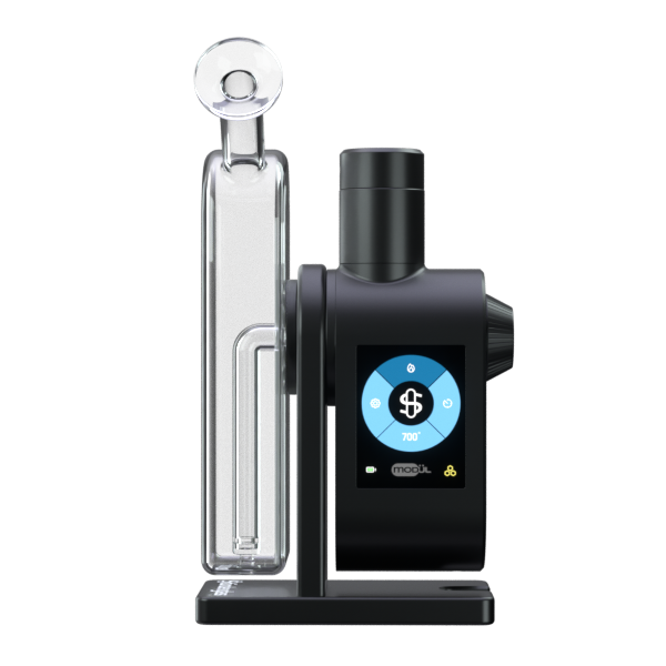 A clean, front-facing studio product shot displaying the Stündenglass Modül + Dok Deluxe Travel Set in Clear Glass. The photo highlights the black Modül smart power unit docked alongside the clear borosilicate glass globe perched on the anodized aluminum Dok stand assembly.