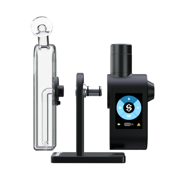 A detailed, front-facing exploded studio shot showcasing the Stündenglass Modül + Dok Deluxe Travel Set in Clear Glass disassembled. The layout illustrates how the black Modül power base, the clear borosilicate glass globe, and the heating tank assembly connect into their designated mounting slots on the anodized aluminum Dok dock base.