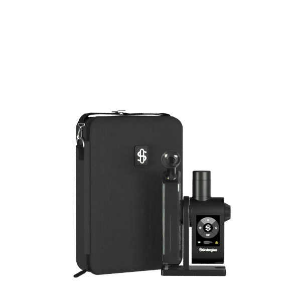 A premium studio product shot displaying the fully assembled Stündenglass Modül + Dok Deluxe Travel Set in Gray Glass standing upright on a clean gray background. Positioned directly next to the elegant, handheld anodized aluminum e-rig is its official hardshell fabric travel case, shown unzipped to highlight its custom-molded protective compartments and rugged drop-resistant build.
