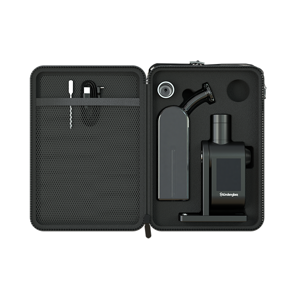 A high-angle studio shot looking inside the open Stündenglass Modül + Dok Deluxe Travel Case. The image showcases the premium, custom-molded foam interior slots, revealing how the Dok handle, Modül power base, smoky gray glass globe, magnetic tank sleeves, loading tool, and charging cables are safely organized and securely isolated for high-impact travel protection.