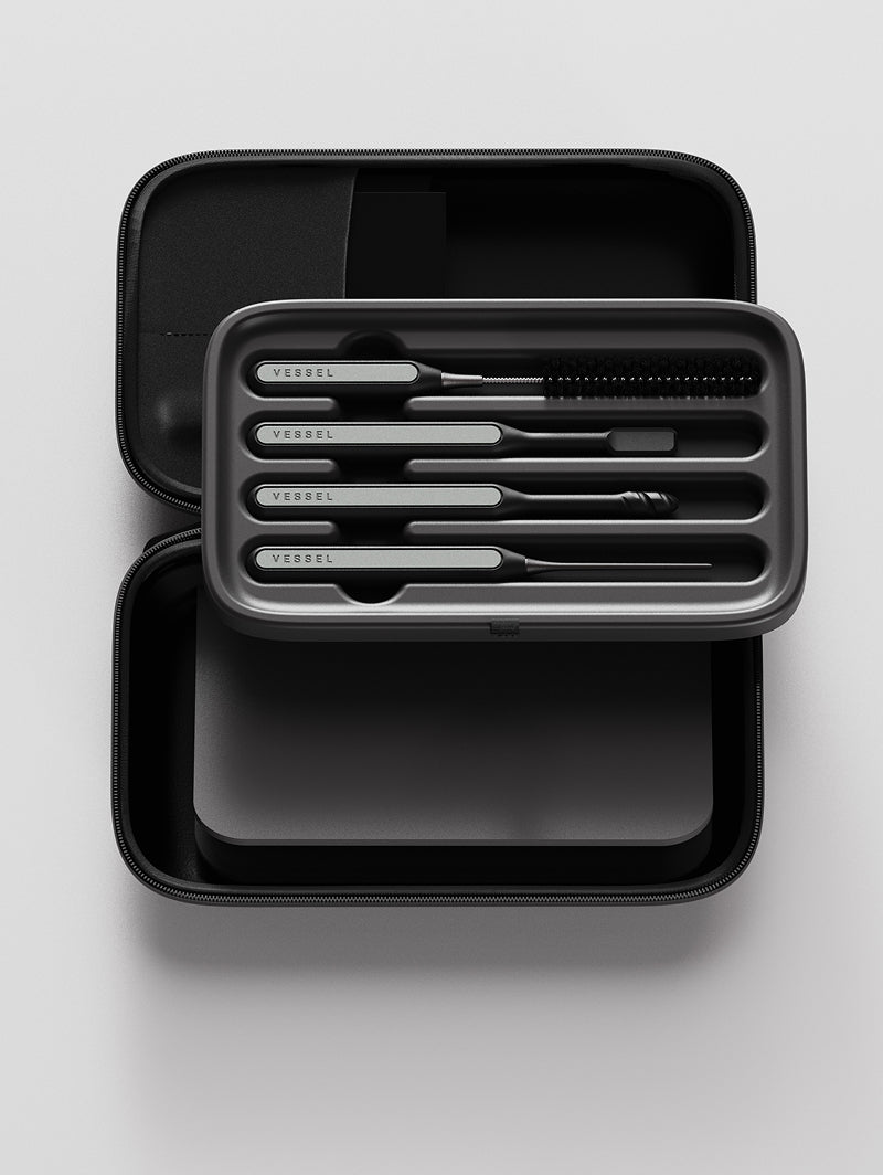A detailed shot of the Vessel Care Kit components hovering above the open EVA carry case. The image showcases the precision-molded tool holder that keeps the cleaning instruments organized, alongside the integrated mesh storage pocket and the compact, travel-friendly layout of the kit.