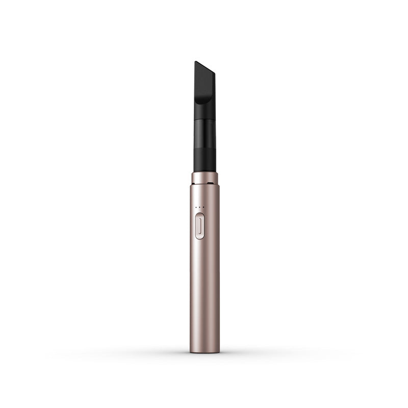A clean, front-facing studio product shot of the Vessel Core 510 vape battery in Blush. The ultra-slim, compact stick pen stands perfectly vertical, highlighting its smooth, matte pastel pink anodized aluminum finish, the centralized silver power button, the 3-LED indicator array right above it, and the signature wide 510 connection crown at the top housing an installed clear glass oil cartridge.