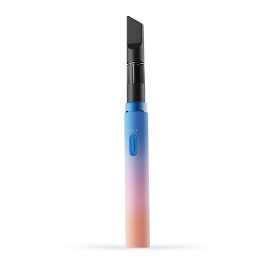 A clean, front-facing studio product shot of the Vessel Core 510 vape battery in Dusk. The ultra-slim, compact stick pen stands perfectly vertical, highlighting its smooth, matte dark charcoal anodized aluminum finish, the centralized silver power button, the 3-LED indicator array right above it, and the signature wide 510 connection crown at the top housing an installed clear glass oil cartridge.