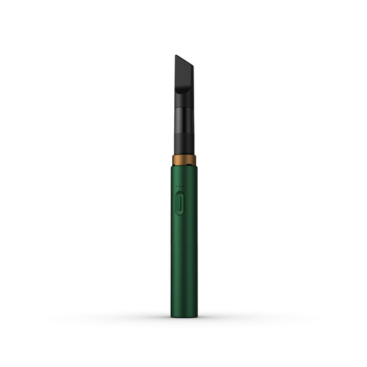A clean, front-facing studio product shot of the Vessel Core 510 vape battery in Emerald. The ultra-slim, compact stick pen stands perfectly vertical, highlighting its smooth, rich green anodized aluminum finish, the centralized silver power button, the 3-LED indicator array right above it, and the signature wide 510 connection crown at the top housing an installed clear glass oil cartridge.