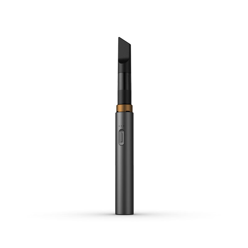 A clean, front-facing studio product shot of the Vessel Core 510 vape battery in Stone. The ultra-slim, compact stick pen stands perfectly vertical, highlighting its smooth, matte sand-gray anodized aluminum finish, the centralized silver power button, the 3-LED indicator array right above it, and the signature wide 510 connection crown at the top housing an installed clear glass oil cartridge.