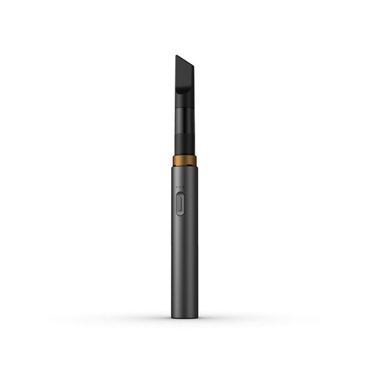 A clean, front-facing studio product shot of the Vessel Core 510 vape battery in Stone. The ultra-slim, compact stick pen stands perfectly vertical, highlighting its smooth, matte sand-gray anodized aluminum finish, the centralized silver power button, the 3-LED indicator array right above it, and the signature wide 510 connection crown at the top housing an installed clear glass oil cartridge.