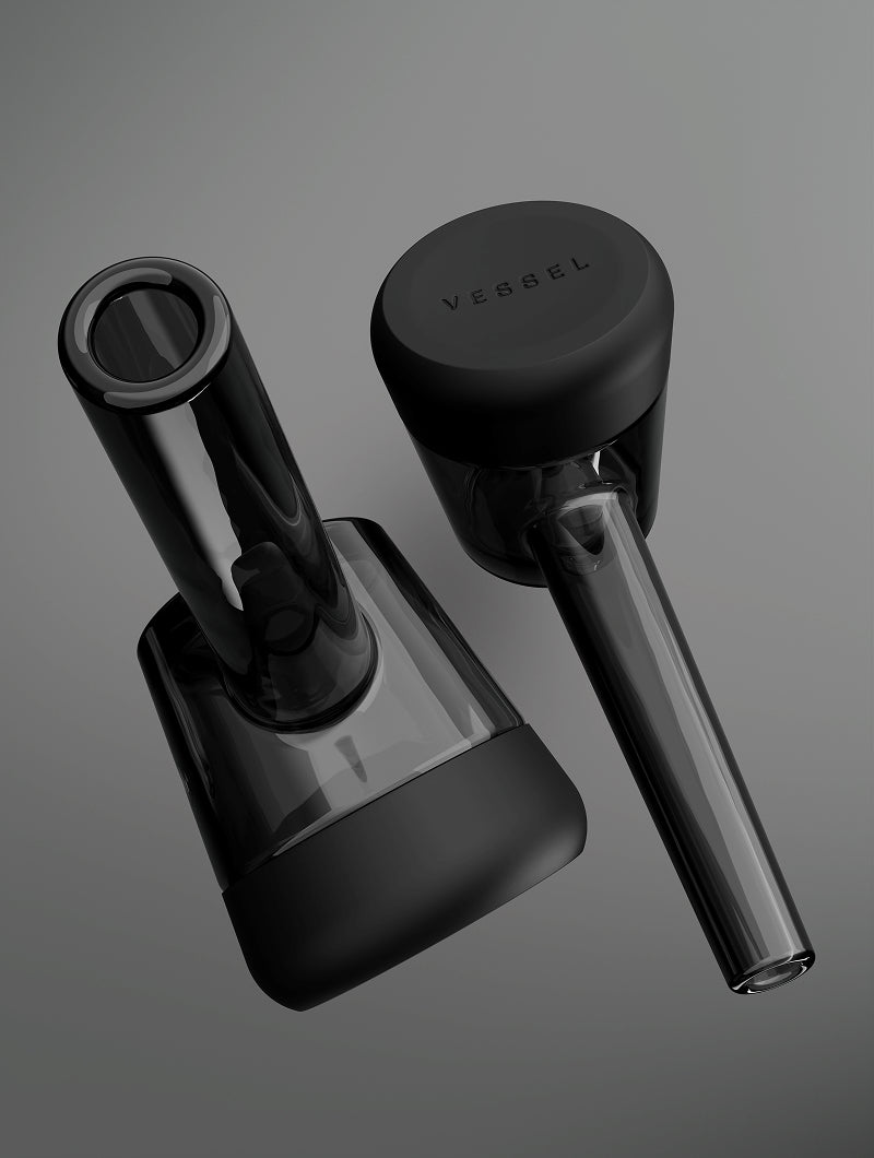 A close-up shot from the bottom of the Black Vessel Forge, emphasizing the thick, hand-sculpted glass bulb and the protective silicone wrap. This angle showcases the ergonomic curves and the heavy-duty construction that makes each piece a unique, artisanal masterpiece.