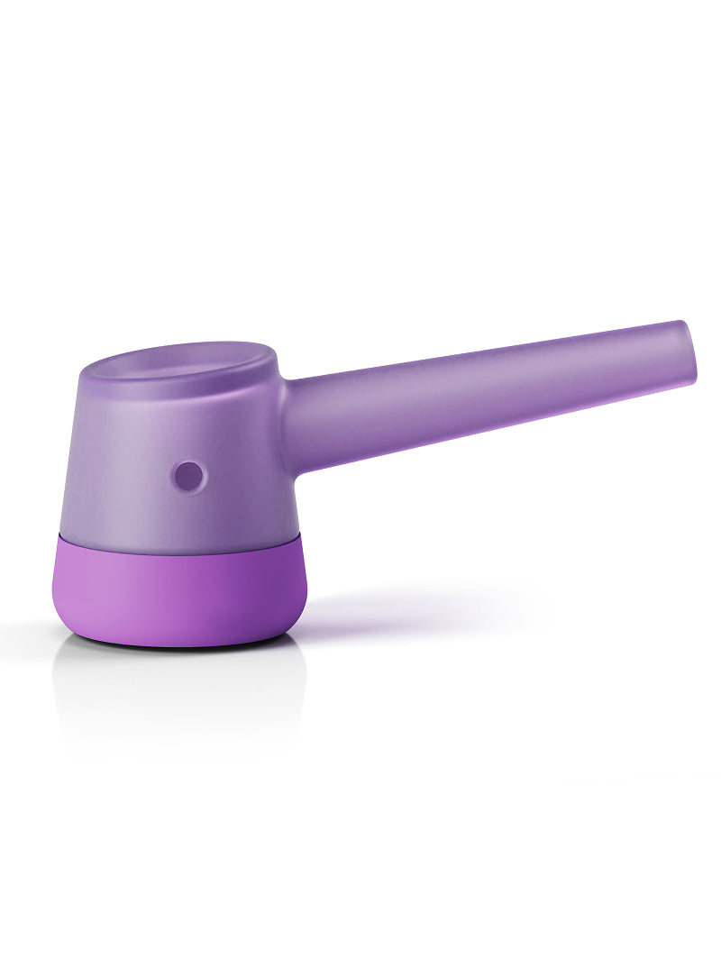 A side view of the Vessel Forge Glass Pipe in Lilac. The image highlights the ergonomically sculpted borosilicate glass body and the deep bowl, showcasing the smooth, artisan curves transitioning into the protective lilac silicone base at the bottom.