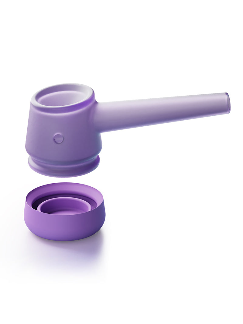 detailed shot of the Lilac Vessel Forge with the borosilicate glass pipe removed and hovering directly over the removable silicone base. This view clearly demonstrates the "first-of-its-kind" modular design for easy cleaning and surface protection.