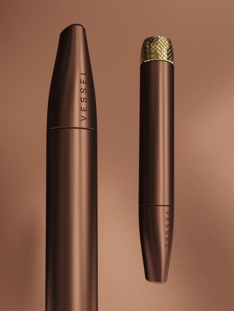 A duo of Vessel Helix Sierra pipes shown from two different angles. This view showcases the ergonomic tapering and the consistent, matte earthy-sand finish across the entire device, illustrating its rugged yet sophisticated aesthetic.