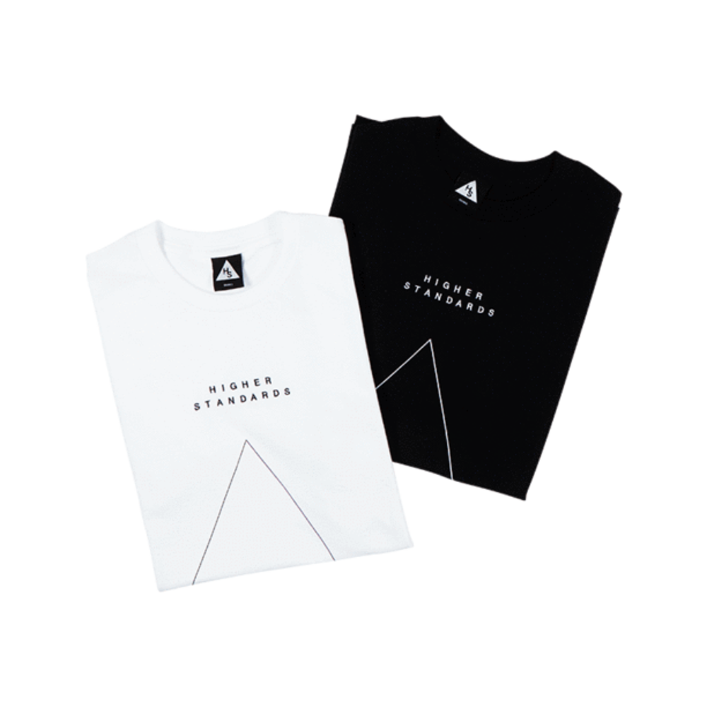 Two Higher Standards T-shirts, one black and one white, neatly folded to display the subtle embroidered text and triangle logo.