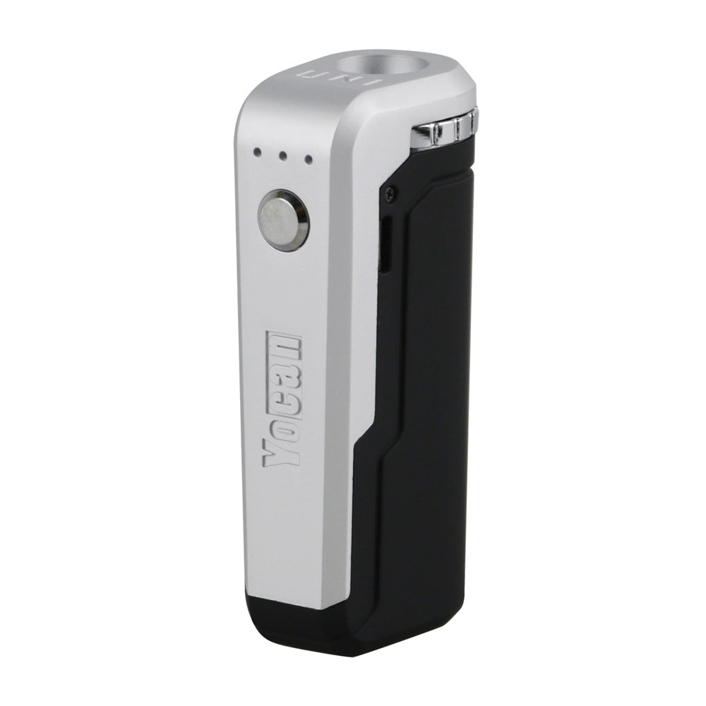 A front-angle profile of the Yocan UNI in Black Silver. This two-tone variant features a matte black main body with a contrasting metallic silver top section and adjustment dial. The image emphasizes the adjustable cartridge chamber and the sleek, technical aesthetic of the multi-colored design.