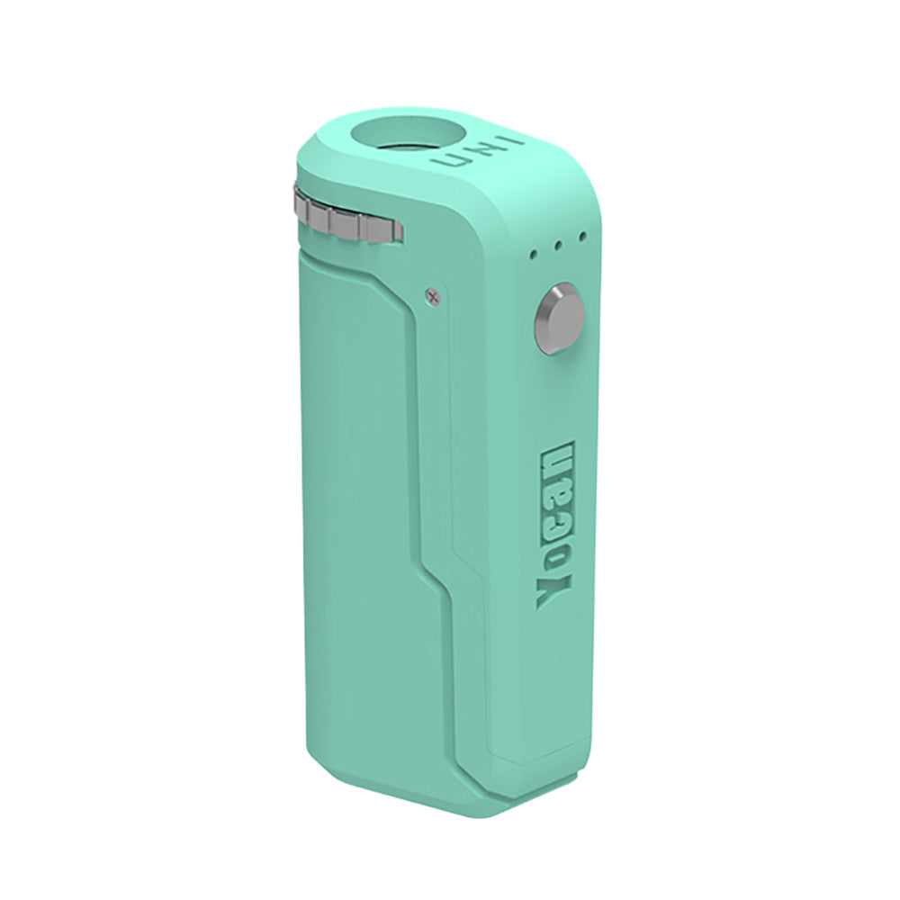 A front-angle profile of the Yocan UNI in Mint Green. This variant is shown in a bright, refreshing pastel green matte finish. The image emphasizes the recessed cartridge port and the embossed "UNI" branding on the top, showcasing the device's compact and ergonomic design.