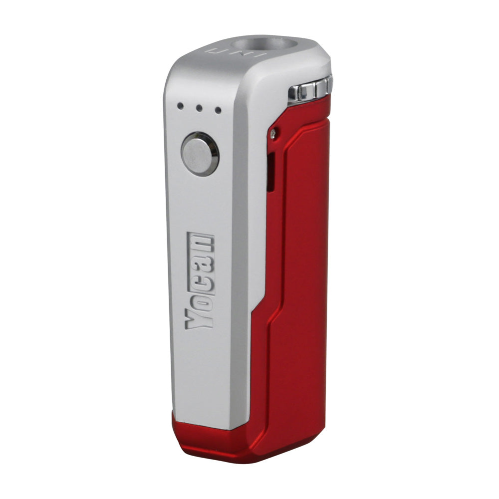A front-angle studio shot of the Yocan UNI in Red. The device features a deep, vibrant crimson matte finish. The silver firing button and adjustment dial provide a sharp contrast, emphasizing the device's ergonomic layout and the signature 3-light LED voltage indicator.