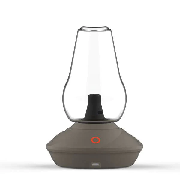 A detailed studio product shot showcasing the Zenco Duo Vaporizer in the elegant Stone finish colorway. The shot captures the minimalist, textured speckled-gray stone aesthetic of the electronic base unit beneath its crystal-clear, removable glass vapor cup attachment, emphasizing its compact, premium countertop design.