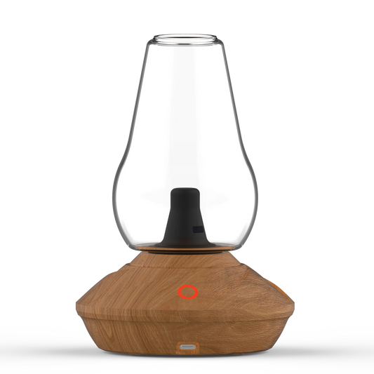 A clean front-facing studio product shot of the Zenco Uno Vaporizer highlighting the rich Wood finish base. The compact tabletop device stands upright on a clean background, showcasing its natural wood-grain styled electronic base unit beneath a single, clear borosilicate glass vapor cup chalice.